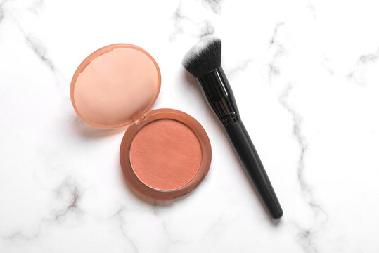 Top view of face cream blusher and makeup brush. Beauty and makeup concept