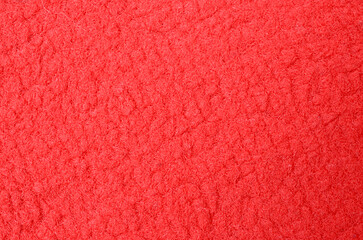 Full frame vibrant red fleece fabric texture background for fashion and apparel design. © TeacherPhoto