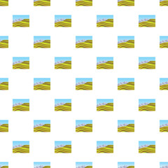 Obraz premium Repeating pattern showing rolling green fields, distant mountains, and blue sky
