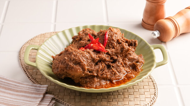 Rendang Ayam, traditional food from Padang, Indonesia. Chicken stew with spices, herbs and coconut milk