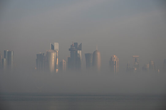 Doha Aerial view of West bay Doha during fog, hazy and mist weather in Qatar 	