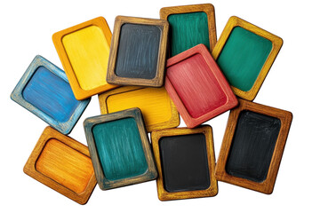 Fototapeta premium A collection of various colorful wooden rectangular chalkboard frames arranged in a messy pile with vibrant painted surfaces and rustic textured edges on white background