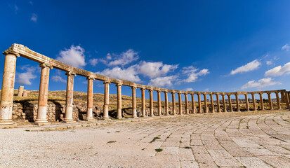 The Oval Plaza, one of the most recognizable landmarks of the ancient Roman city of Jerash in Jordan. The unique elliptical forum is surrounded by an impressive colonnade
