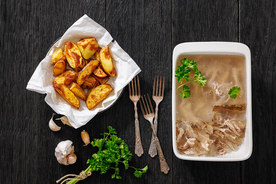 Gourmet meat aspic with roasted potato wedges