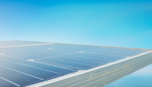 Solar Panel Reflecting Sunlight Against Sky
