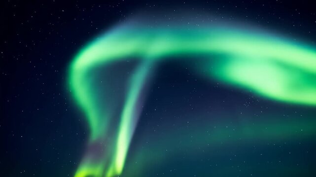 Green aurora streams in a dark sky scattered with bright white stars