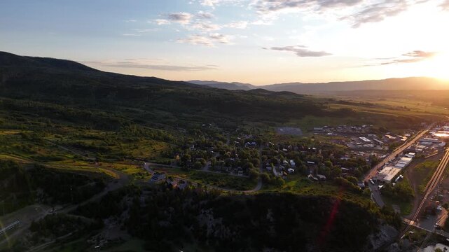 Drone Shot of Sunset Above Landscape and Steamboat Springs Colorado USA in Summer Season