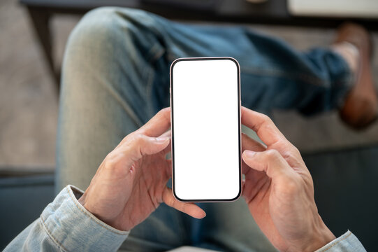 Close up of white blank smartphone display held with both hands, suitable for application or website