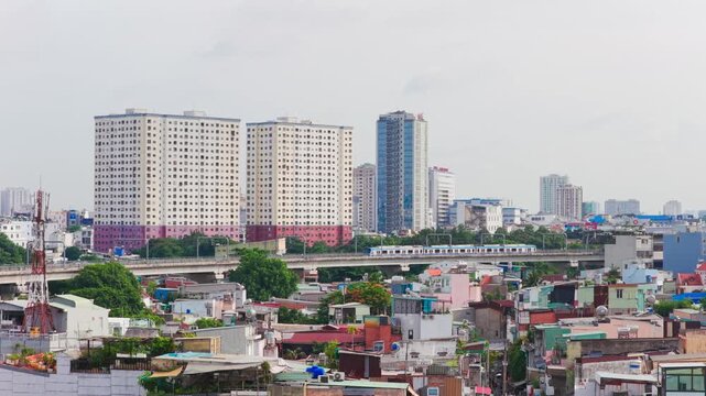 Aerial view of Ho Chi Minh City Metro Train passing through urban skyline in Vietnam