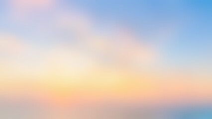 Naklejka premium Wide 16:9 pastel sunset blurred gradient background. Defocused soft golden hour sky and ocean backdrop for website banner with copy space.