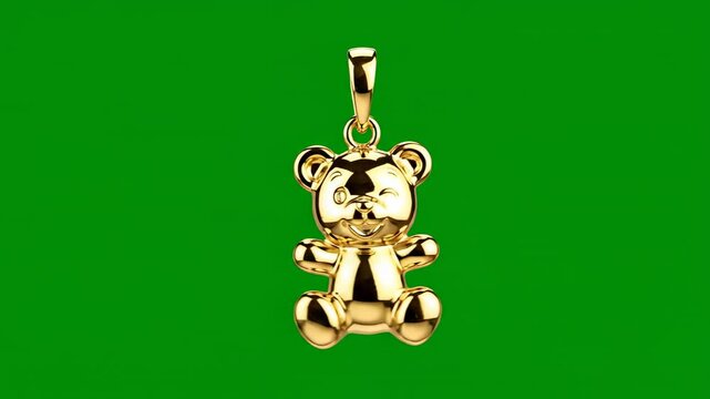 Golden Teddy Bear Charm suspended against a vibrant green backdrop with subtle black bands