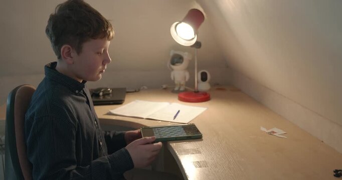 Kid Boy Play Chess on Tablet. 4K 10-bit