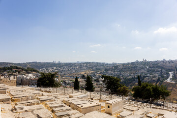 Obraz premium Historic stone tombs on the Mount of Olives overlooking the rolling valleys and landscape of Jerusalem