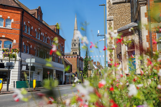 South street with Spire Church and bright blooms, Farnham, UK