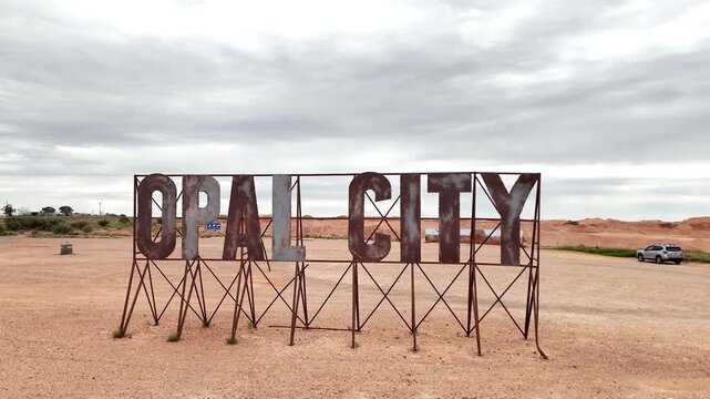Iconic Rusted Metal Opal City Welcome Sign at the Entrance to Coober Pedy, South Australia Outback