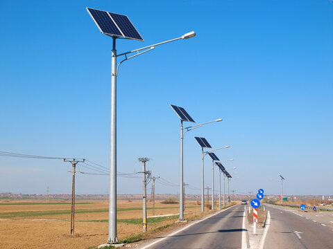 Street lighting pole with photovoltaic panel and LED lamp lights