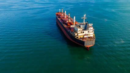 High angle aerial view of a massive dry bulk carrier ship navigating deep waters © Bugra Kaan Ersoy