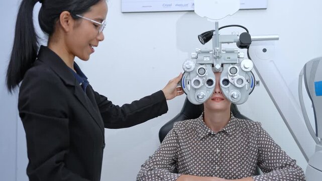Eye care professional conducting a vision test with a patient using a phoropter in a contemporary clinic environment