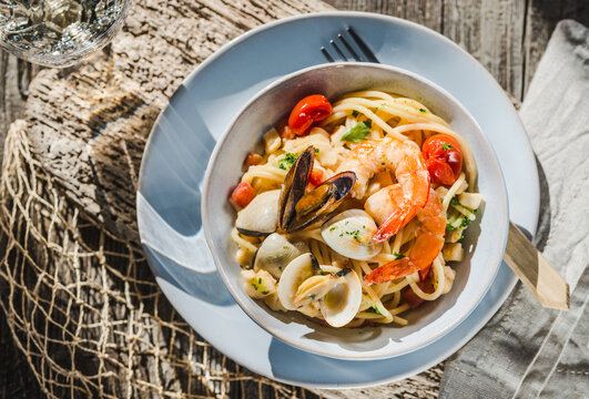 Pasta plate, seafood spaghetti with different claims, shrimps italian food. 	