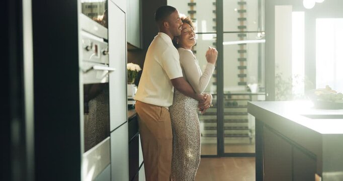 Happy, hug and couple in kitchen at house with bonding, support or connection in marriage. Smile, commitment and black man embracing woman for safety, love and care in relationship at apartment.