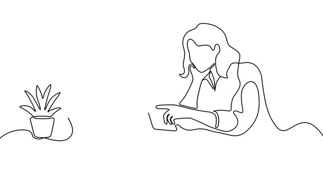 Two businesswomen working with laptops in the office