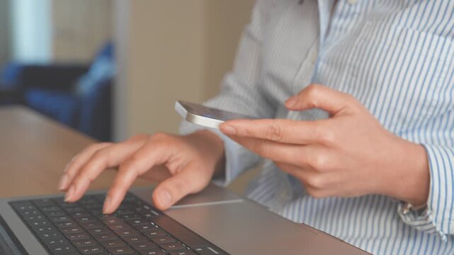 Professional Working with Smartphone, Laptop for AI Powered Business, SaaS Platforms, CRM Systems. Modern Digital Workplace featuring Productivity, Cloud Collaboration, Remote Work , Automation