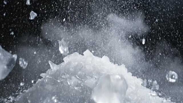 Ice crystals shatter and explode in a dark environment with frosty particles flying everywhere with a pile of crushed ice