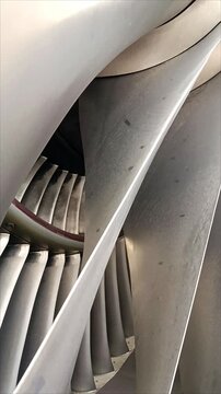 Close-up footage of commercial aircraft engine fan blades rotating inside a modern turbofan engine