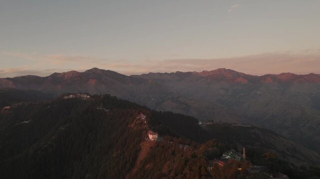 Aerial view of mountains and buildings at sunset in Chakrata, Dehradun, Uttarakhand