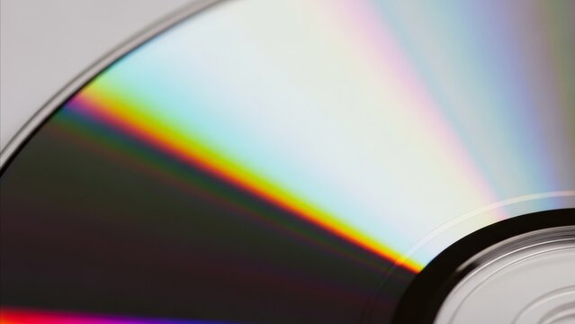 Technology - Close Up Macro Shot of Compact Disc Surface Showing Colorful Rainbow Iridescent Light Reflection