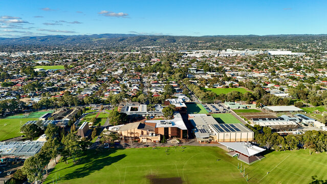 Marion, Adelaide, South Australia &ndash; 4K aerial drone view of Westminster School, private school campus, sports ovals, playing fields, tennis courts and suburban landscape