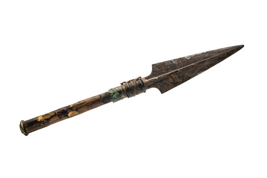 A traditional spear with a pointed metal head and a worn wooden handle, featuring wire binding, isolated on a black background, for inspection