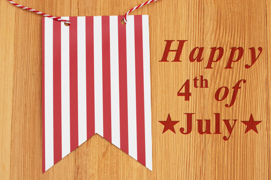Happy 4th of July  message with retro USA red and white banner on wood