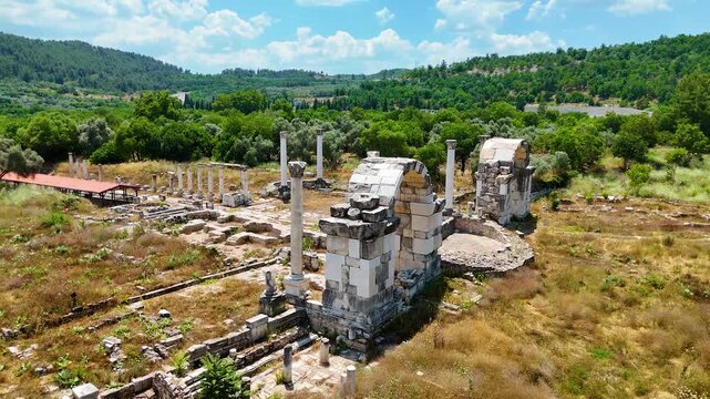 180 degree aerial panorama over Stratonikeia ancient city, full archaeological site sweep Turkey 4K