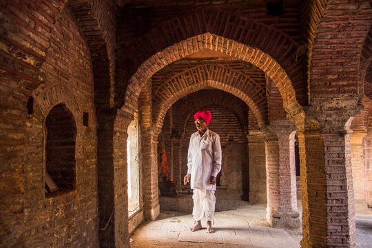 An Indian man prays at a Temple, India