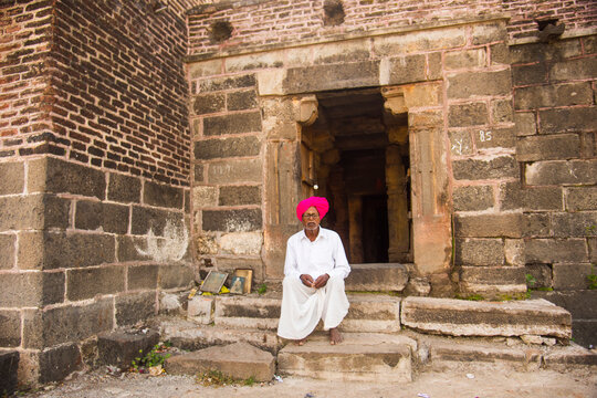 An Indian man prays at a Temple, India