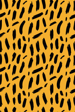 Seamless abstract leopard print pattern with black paint brush strokes on yellow background. Seamless abstract leopard print pattern with black paint brush strokes on yellow background. 