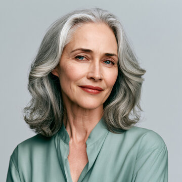 successful professional woman age 50 with healthy restored hair, confidence and beauty concept