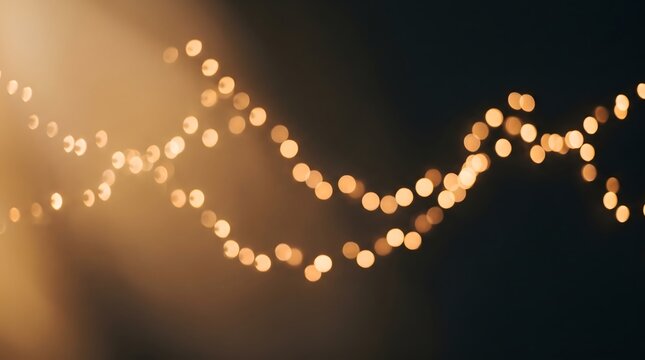 Soft bokeh light leak overlay background, blurred ambient warm string lights across a dark background