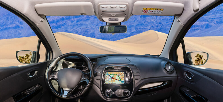 Car windshield view of sand dunes in Death Valley, USA