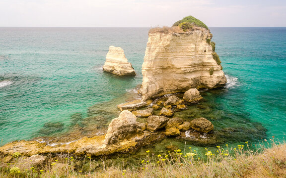 Scenic rocky cliffs of Torre Sant Andrea, Salento, Italy