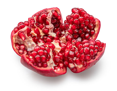 Opened ripe pomegranate fruit with red pomegranate seeds isolated on white background. Clipping path