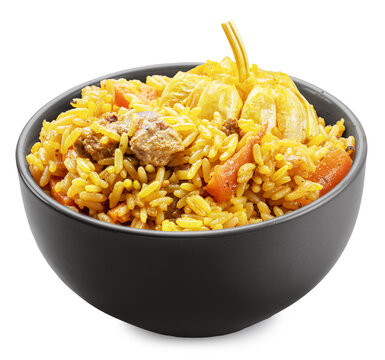 Clay bowl of traditional uzbek lamb pilaf with garlic isolated on a white background. Traditional asian food.