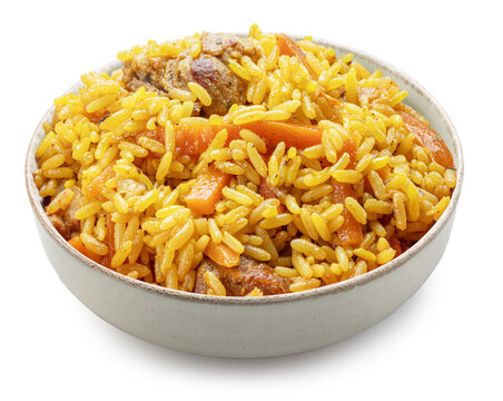 Clay bowl of traditional uzbek lamb pilaf with garlic isolated on a white background. Traditional asian food.