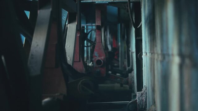 Empty secluded industrial factory interior with old machinery, deserted building