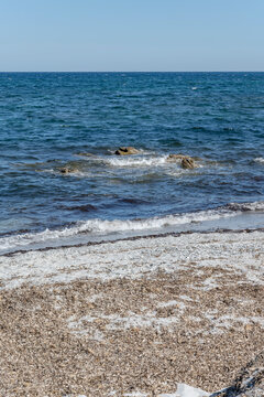 white sand and skerry in blue water at Matta e Peru beach on Mediterranean coast, near Budoni, Italy