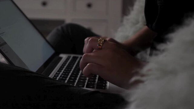 Close up of female hands typing on laptop keyboard, woman working on computer in cozy home setting, remote work and digital nomad lifestyle