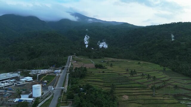 Aerial view of Tiwi Geothermal Steam fields, pipelines and rice terraces in Albay, Philippines. Ideal for projects focused on clean energy and sustainability.