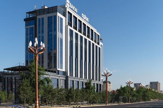 Bishkek, Kyrgyzstan - June 13, 2026: The modern office building of the Aplus Business Center on the city boulevard in Bishkek, Kyrgyzstan