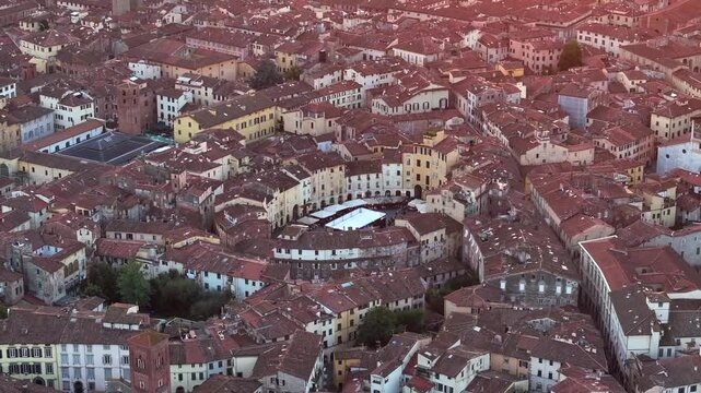 Aerial view of the main square, Piazza dell'Anfiteatro, in Lucca, Tuscany, Italy. Medieval Historical Center at Twilight